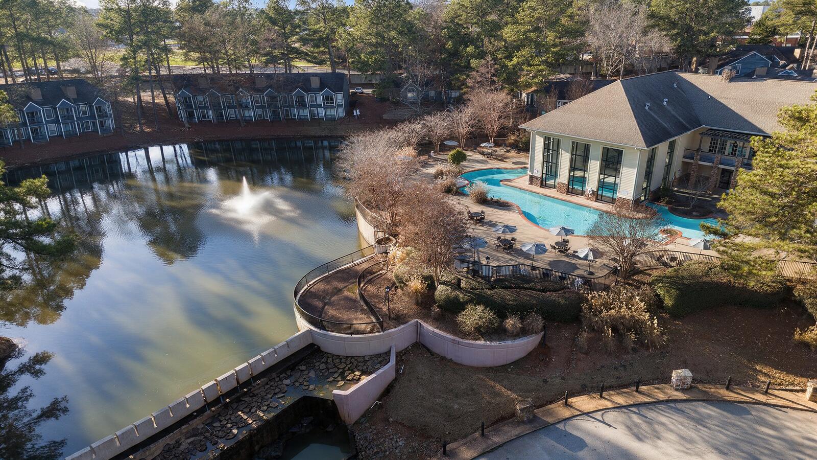 Aerial view of the East Ponce Village community in Atlanta: lake with fountain, clubhouse and pool
